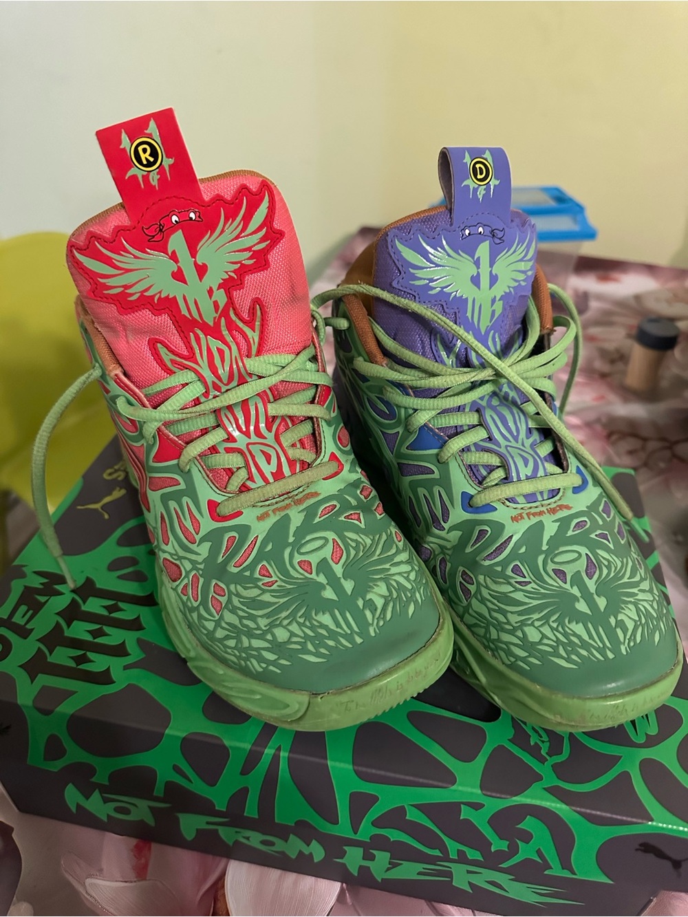 Puma Kids Mismatched Green Sneakers with Pink and Purple Accents